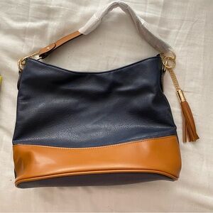 Multi use navy blue & brown bag.  Leather finish with 3 extra accessories